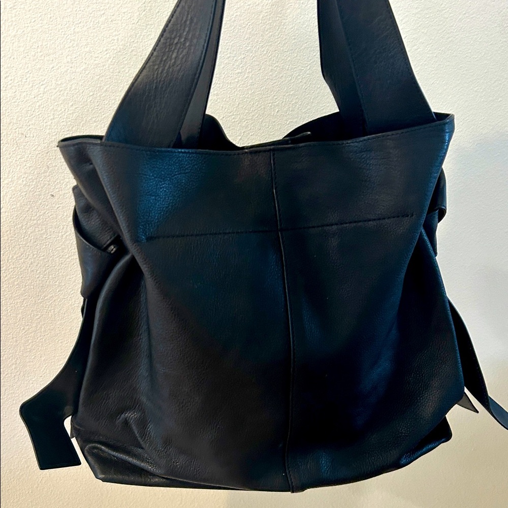Vince Camino Black LeatherTote and 
shoulder. Has knots on each side.Very soft.